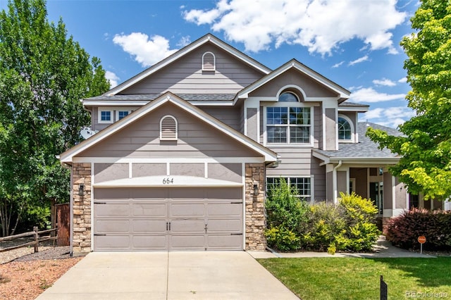 664 Clarendon Dr, Longmont, CO 80504 - traditional-style house with stone siding, concrete driveway, a garage, and roof with shingles