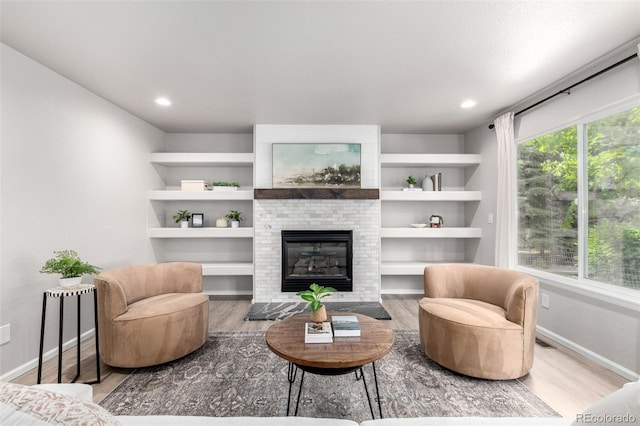 664 Clarendon Dr, Longmont, CO 80504 - living area with wood finished floors, a fireplace, and recessed lighting