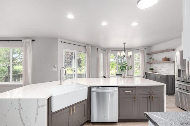 664 Clarendon Dr, Longmont, CO 80504 - kitchen with stainless steel appliances, gray cabinets, open shelves, a chandelier, and recessed lighting