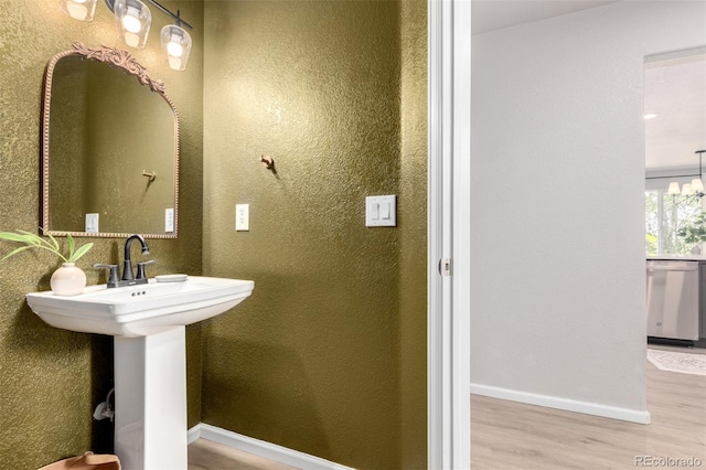 664 Clarendon Dr, Longmont, CO 80504 - bathroom featuring wood finished floors and a textured wall