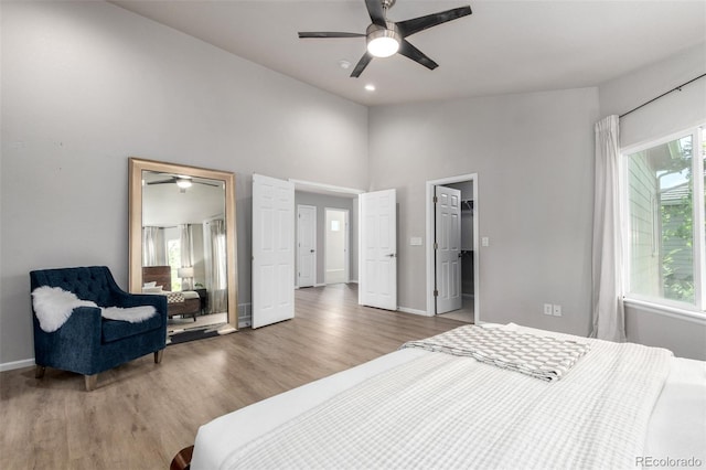 664 Clarendon Dr, Longmont, CO 80504 - bedroom with wood finished floors, high vaulted ceiling, a ceiling fan, and recessed lighting