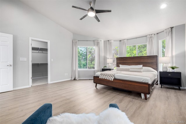 664 Clarendon Dr, Longmont, CO 80504 - bedroom featuring vaulted ceiling, light wood finished floors, a spacious closet, recessed lighting, and a ceiling fan