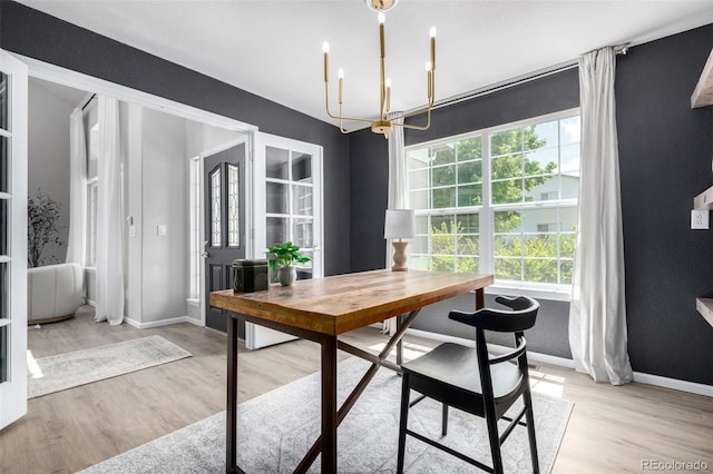 664 Clarendon Dr, Longmont, CO 80504 - dining space featuring a chandelier, light wood-style floors, and an office area