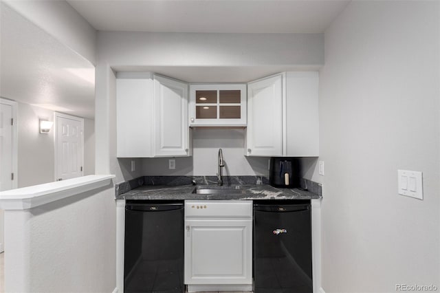 664 Clarendon Dr, Longmont, CO 80504 - kitchen with black dishwasher, white cabinets, dark countertops, and glass insert cabinets