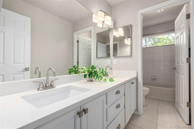 664 Clarendon Dr, Longmont, CO 80504 - bathroom featuring double vanity and tile patterned floors