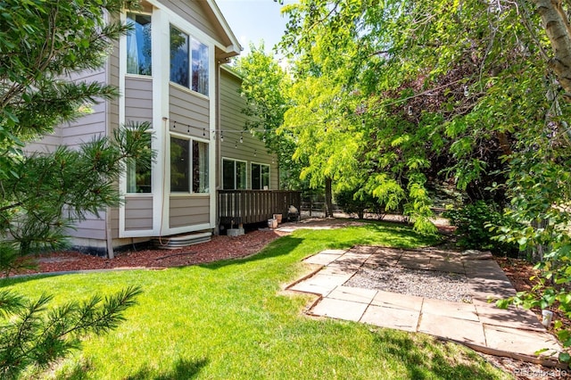 664 Clarendon Dr, Longmont, CO 80504 - view of grassy yard featuring a patio area