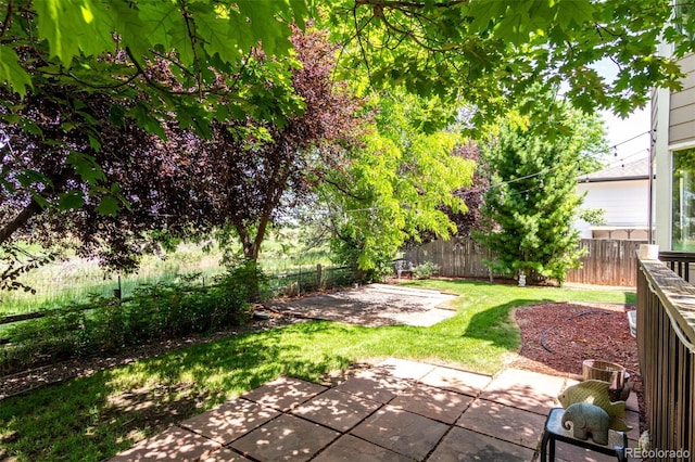 664 Clarendon Dr, Longmont, CO 80504 - fenced backyard with a patio area