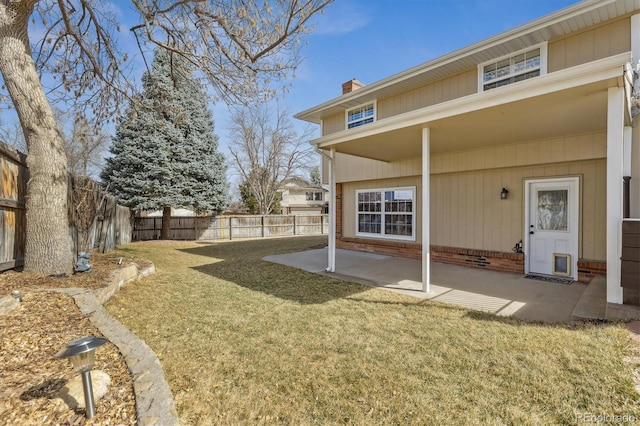 view of yard with a fenced backyard and a patio area