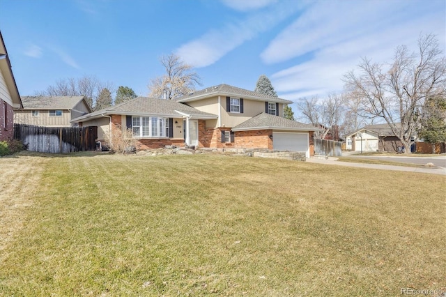 split level home with brick siding, a front lawn, and fence