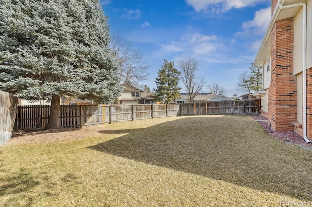 view of yard with a fenced backyard