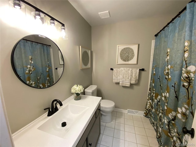 bathroom featuring visible vents, baseboards, toilet, tile patterned floors, and vanity