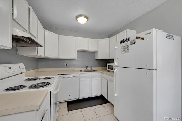 kitchen with white cabinetry, sink, white appliances, and light tile patterned floors