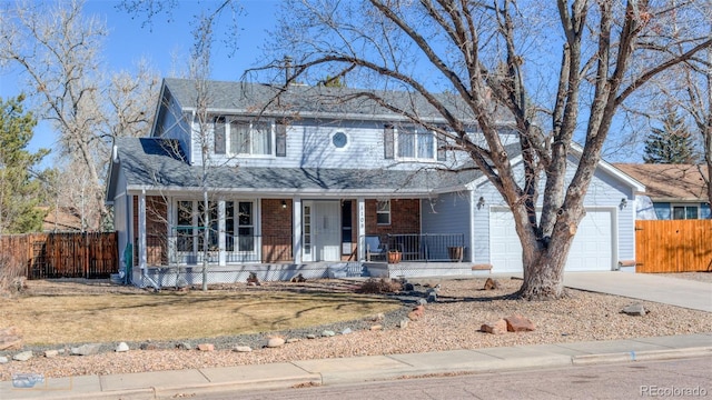 view of front of property with driveway, fence, a porch, and brick siding