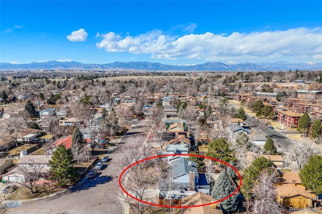 drone / aerial view featuring a residential view and a mountain view