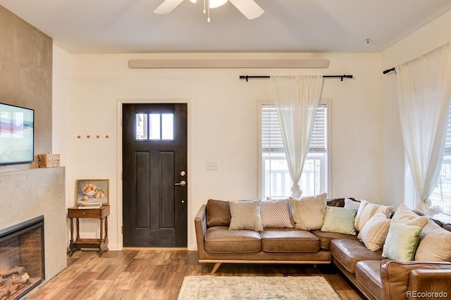 242 Weathervane Ln, Buena Vista, CO 81211 - living room with wood finished floors, ceiling fan, healthy amount of natural light, and a fireplace