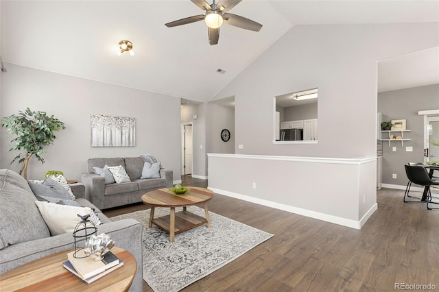 living room with high vaulted ceiling, a ceiling fan, baseboards, wood finished floors, and visible vents