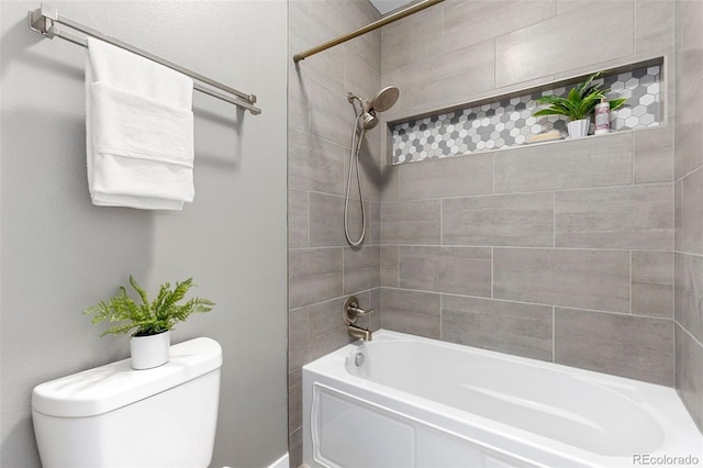 bathroom featuring  shower combination and toilet