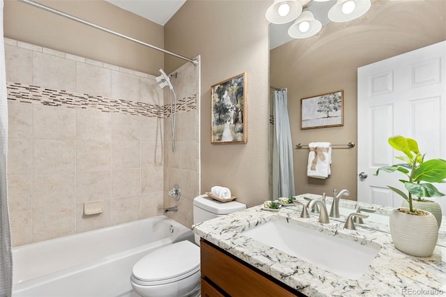 bathroom with vanity, shower / tub combo, and toilet