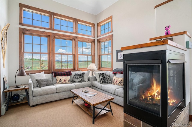 8305 Northstar Unit 8-305, Granby, CO 80446 - living room featuring a glass covered fireplace and a high ceiling