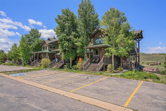 8305 Northstar Unit 8-305, Granby, CO 80446 - view of front facade featuring covered porch, uncovered parking, and stairway
