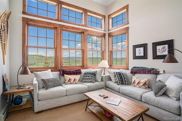 8305 Northstar Unit 8-305, Granby, CO 80446 - living room with healthy amount of natural light, a towering ceiling, and a textured wall