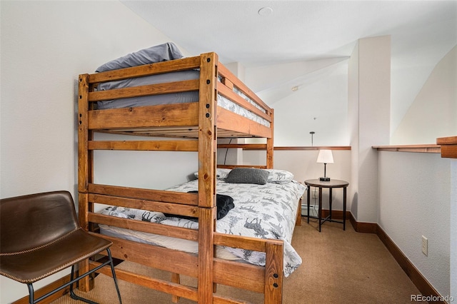 8305 Northstar Unit 8-305, Granby, CO 80446 - bedroom featuring carpet flooring, baseboards, and lofted ceiling