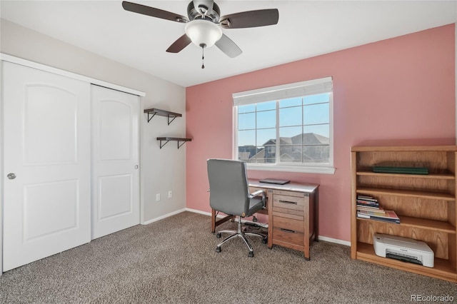 carpeted home office with ceiling fan