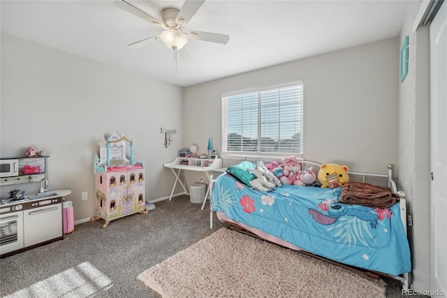 carpeted bedroom featuring a closet and ceiling fan