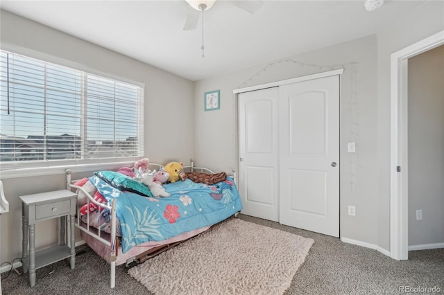 bedroom featuring ceiling fan, a closet, and carpet floors