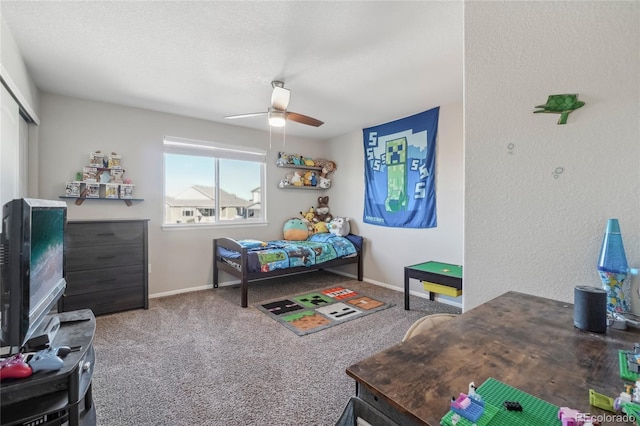 carpeted bedroom with ceiling fan and a closet