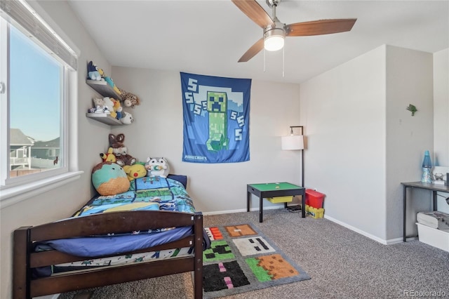 carpeted bedroom with ceiling fan