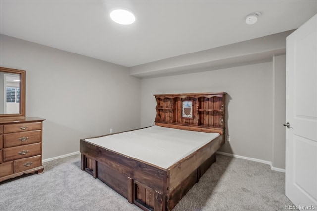 bedroom featuring light carpet