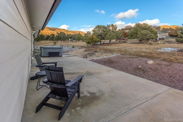 view of patio / terrace featuring a mountain view