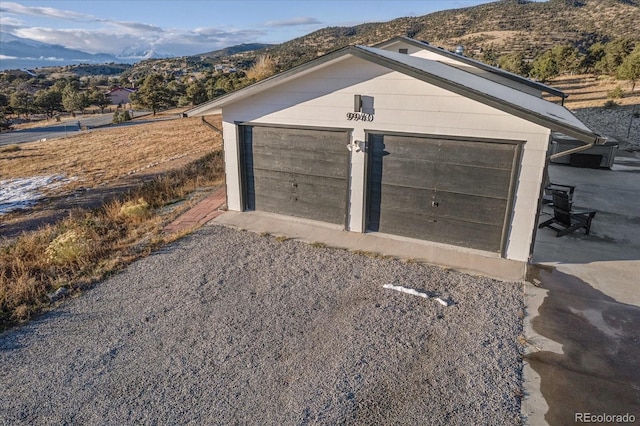 detached garage with a mountain view