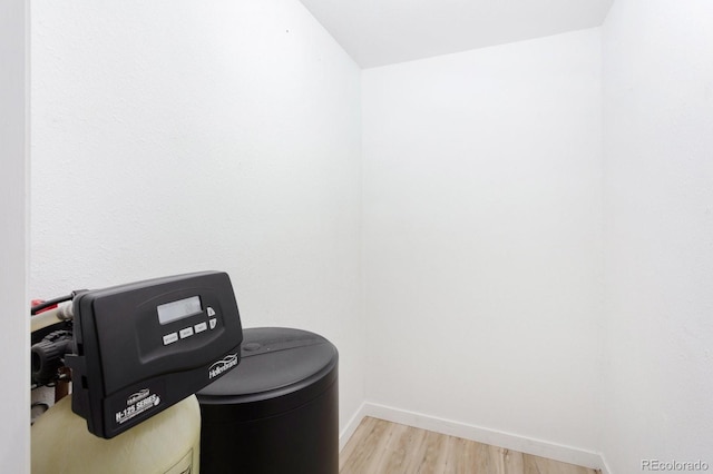 home office with baseboards and light wood finished floors