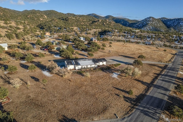 birds eye view of property featuring a mountain view