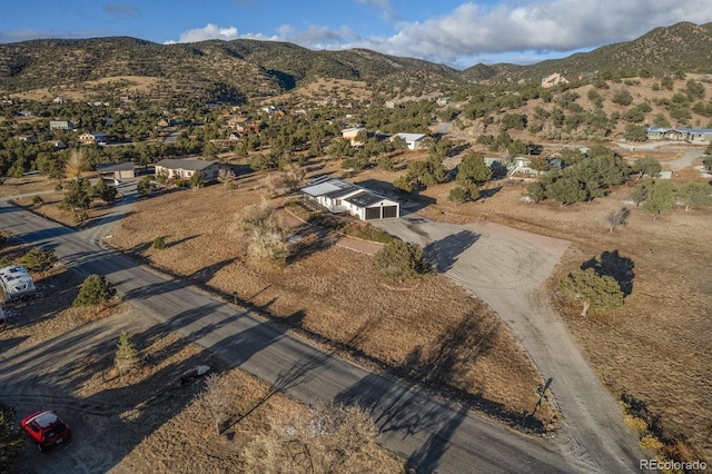 drone / aerial view featuring a mountain view