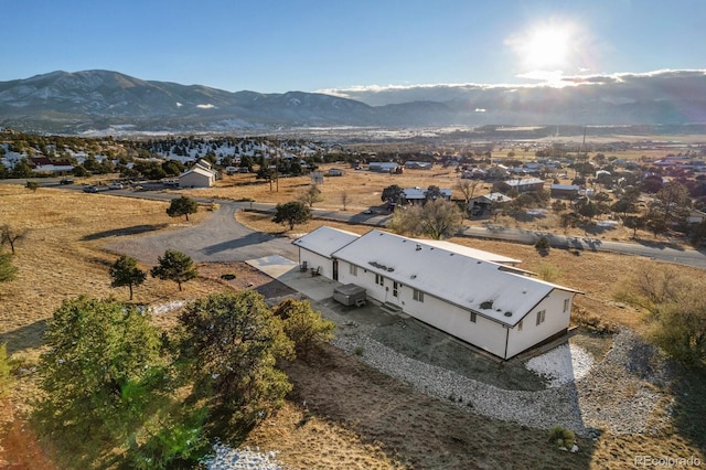 birds eye view of property with a mountain view