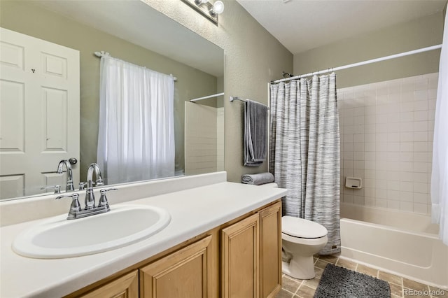 bathroom with a textured wall, tile patterned flooring, toilet, vanity, and shower / bath combination with curtain