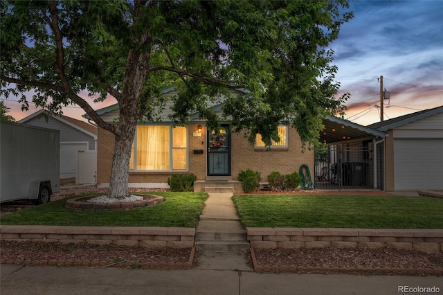 283 Leonard Ln, Northglenn, CO 80233 - view of front of property featuring brick siding and a lawn