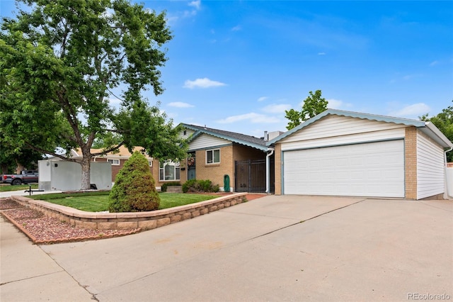 283 Leonard Ln, Northglenn, CO 80233 - ranch-style house with a garage, brick siding, and driveway