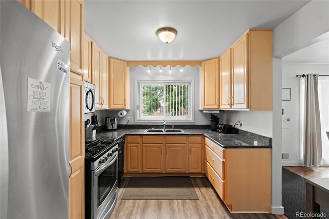 283 Leonard Ln, Northglenn, CO 80233 - kitchen featuring appliances with stainless steel finishes, light brown cabinetry, and light wood-style floors