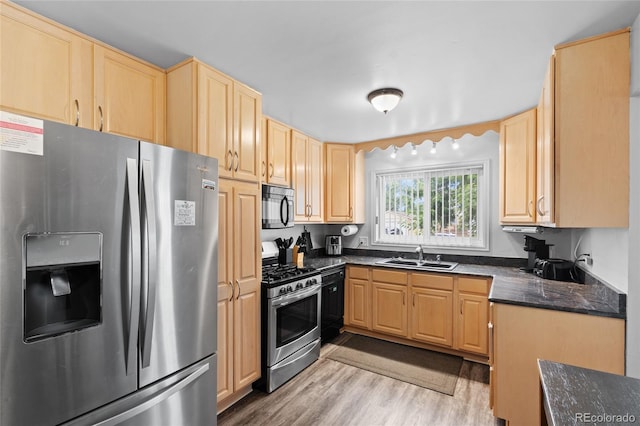 283 Leonard Ln, Northglenn, CO 80233 - kitchen with appliances with stainless steel finishes, light brown cabinets, and light wood-style floors