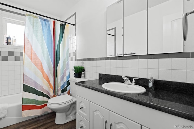 283 Leonard Ln, Northglenn, CO 80233 - full bathroom featuring vanity, shower / tub combo, and wood finished floors