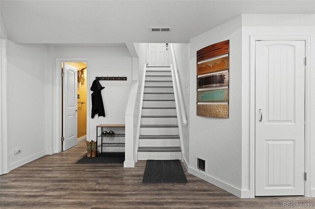 283 Leonard Ln, Northglenn, CO 80233 - stairway featuring wood finished floors and baseboards