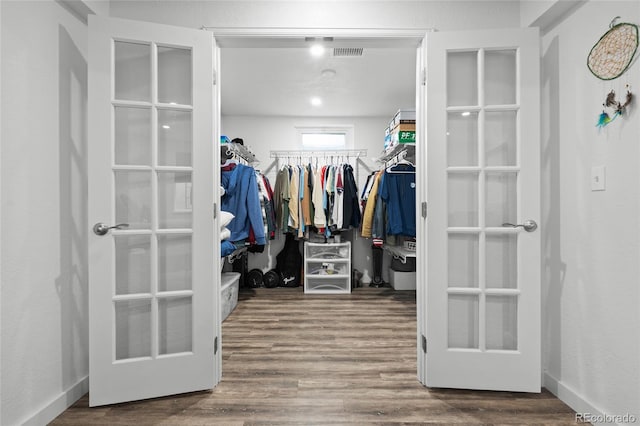 283 Leonard Ln, Northglenn, CO 80233 - walk in closet featuring wood finished floors and french doors