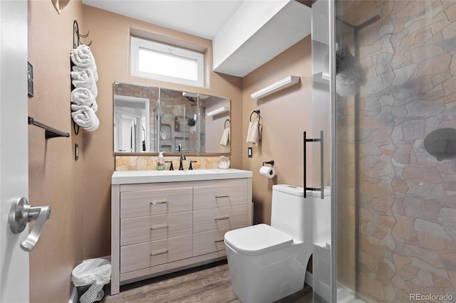 283 Leonard Ln, Northglenn, CO 80233 - full bathroom with vanity, a stall shower, and wood finished floors