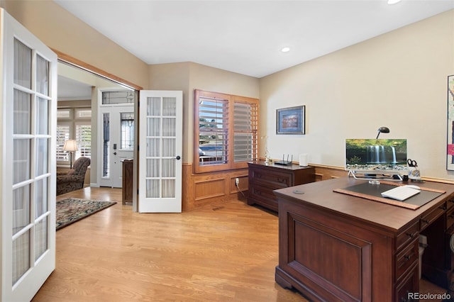 office area with french doors and light hardwood / wood-style flooring