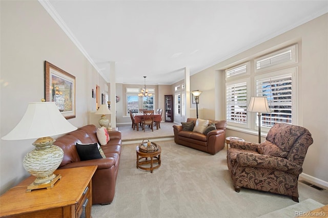 carpeted living room featuring crown molding and a notable chandelier