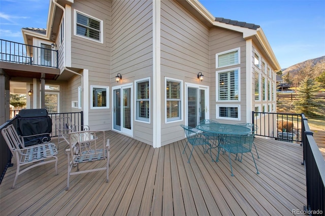 wooden terrace featuring a mountain view